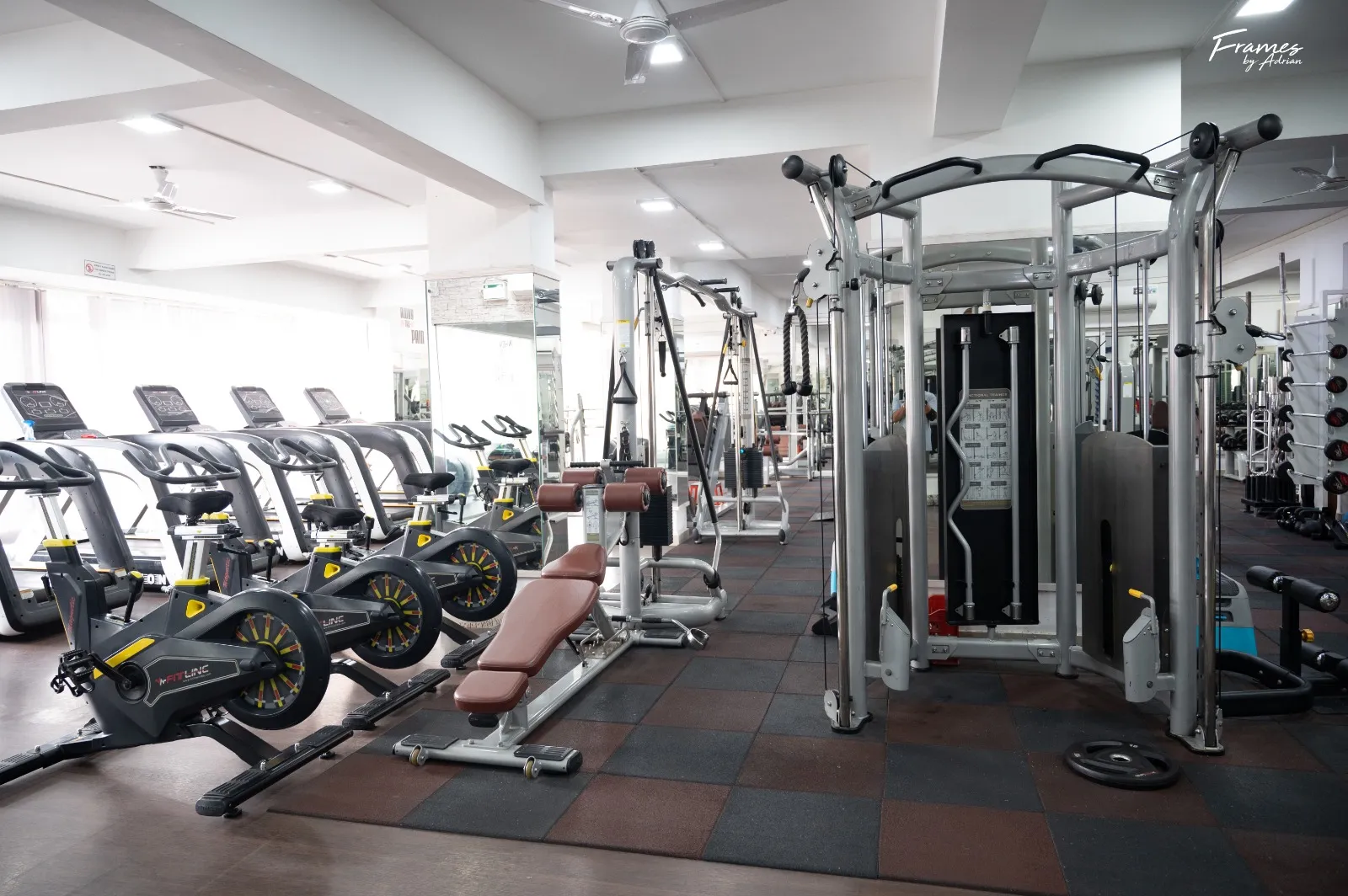Cardio training zone with machines and open gym space.